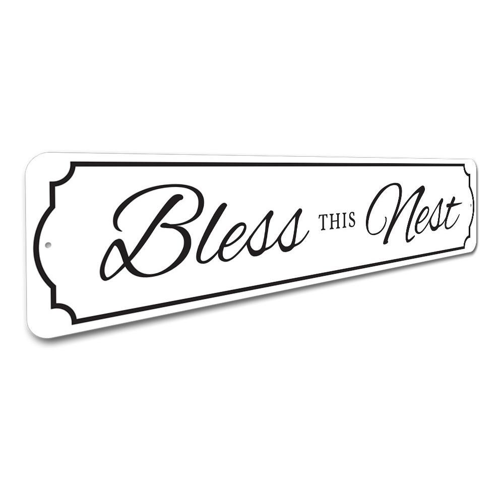 A beautifully crafted Bless This Nest Sign made of quality aluminum, featuring a charming design suitable for home decor.