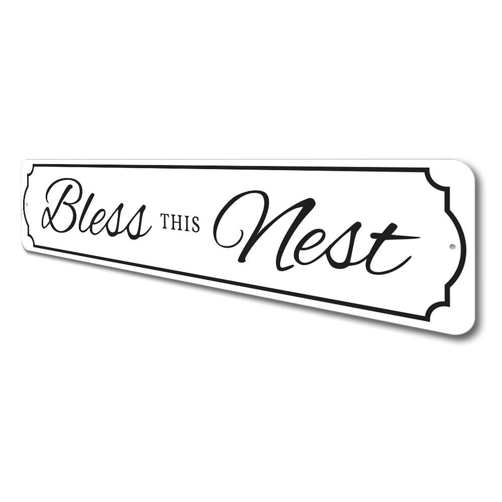 A beautifully crafted Bless This Nest Sign made of quality aluminum, featuring a charming design suitable for home decor.