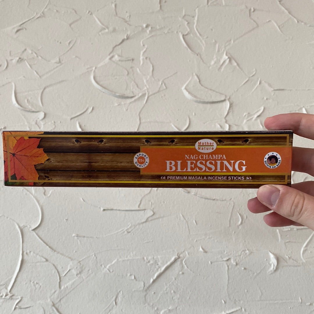 A beautifully crafted Blessing Incense stick with crystals, radiating positive energy and light.