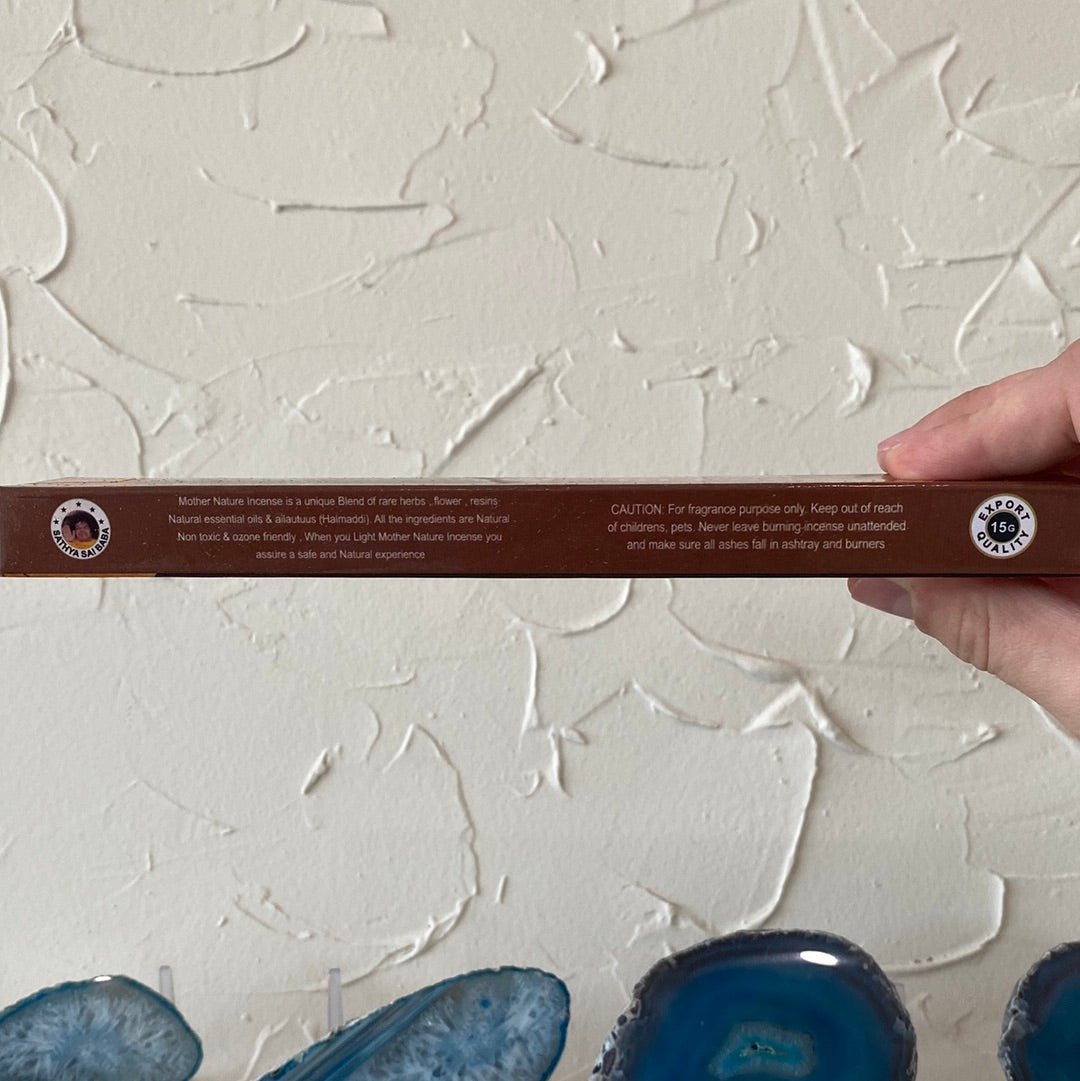 A beautifully crafted Blessing Incense stick with crystals, radiating positive energy and light.