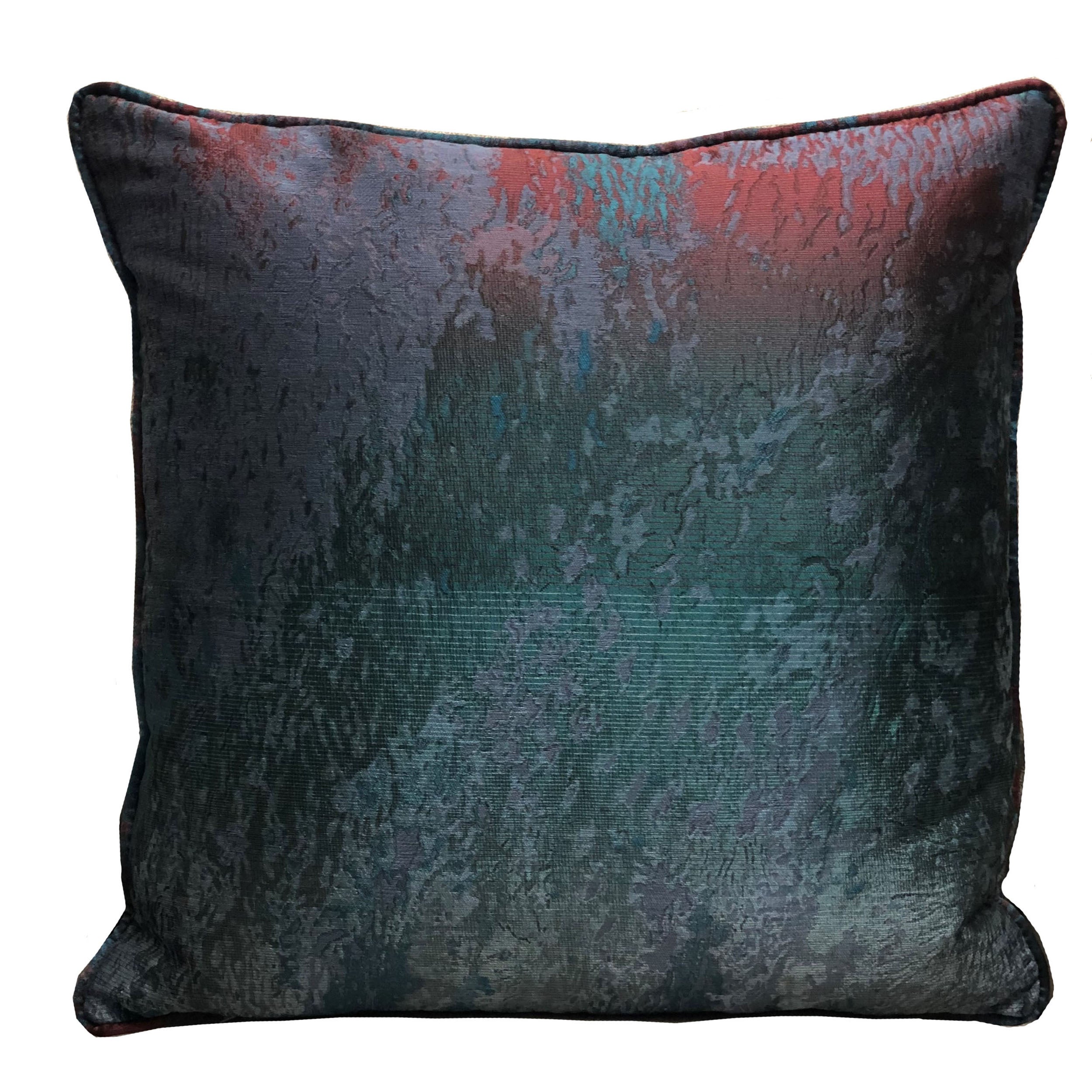 Luxurious throw pillow in blue, green, and red colors, featuring a soft velour fabric and elegant piping edge.