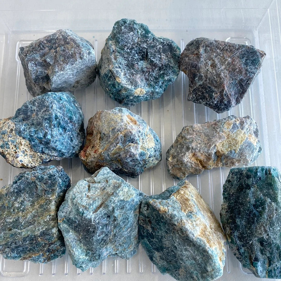 A polished slab of Blue Apatite Rough Cut showcasing its deep aqua color and smooth texture, ideal for healing and decorative purposes.