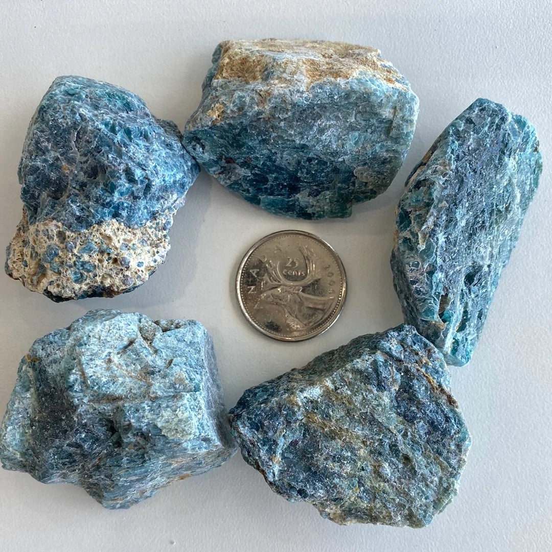 A polished slab of Blue Apatite Rough Cut showcasing its deep aqua color and smooth texture, ideal for healing and decorative purposes.