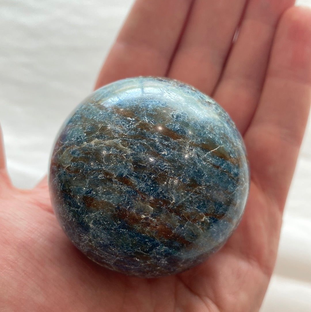 A beautiful Blue Apatite Sphere showcasing electric blue and blue-green hues, perfect for meditation and energy work.