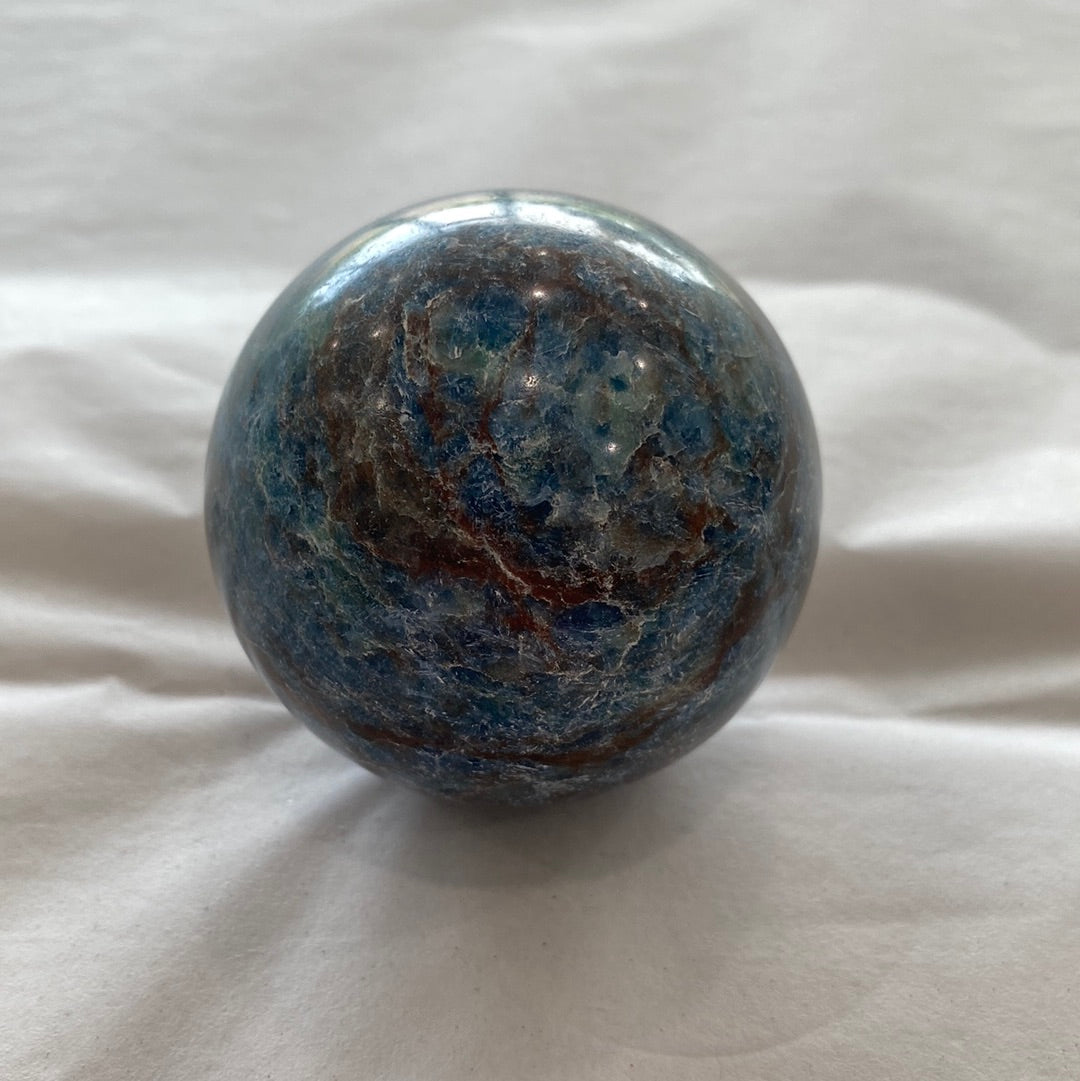 A beautiful Blue Apatite Sphere showcasing electric blue and blue-green hues, perfect for meditation and energy work.