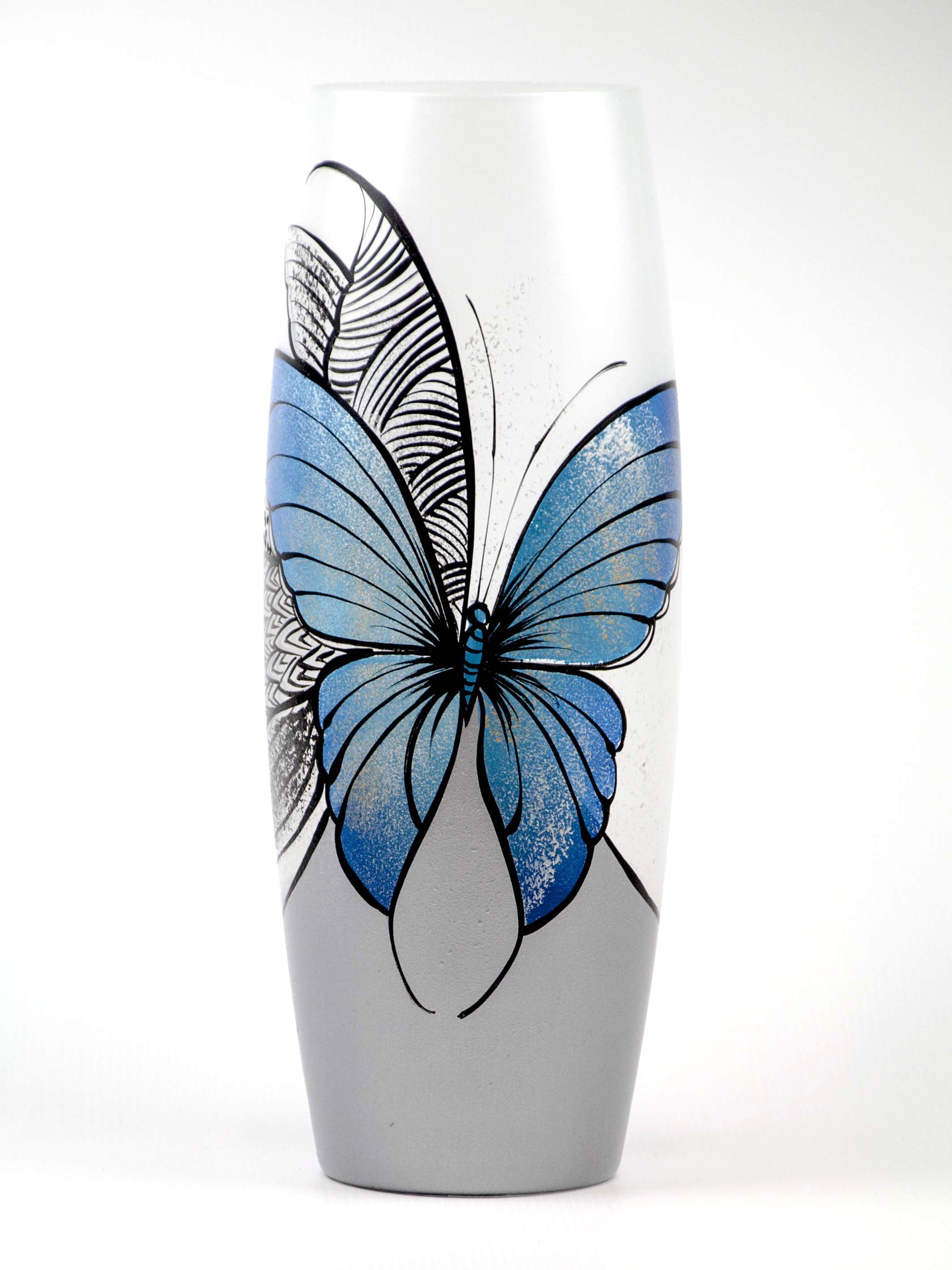 Large handpainted glass vase featuring a blue butterfly design, perfect for displaying flowers.