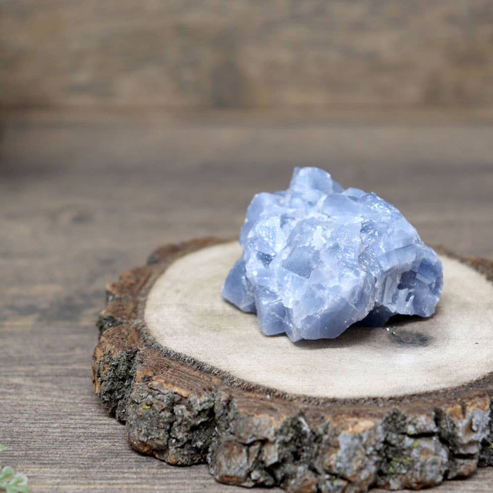 Natural rough cut blue calcite pieces showcasing various shapes and sizes, radiating calming energy.