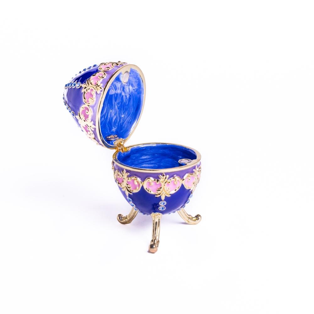 A beautifully crafted Blue Decorated Faberge Egg trinket box adorned with Austrian crystals and 24K gold plating, showcasing intricate details.