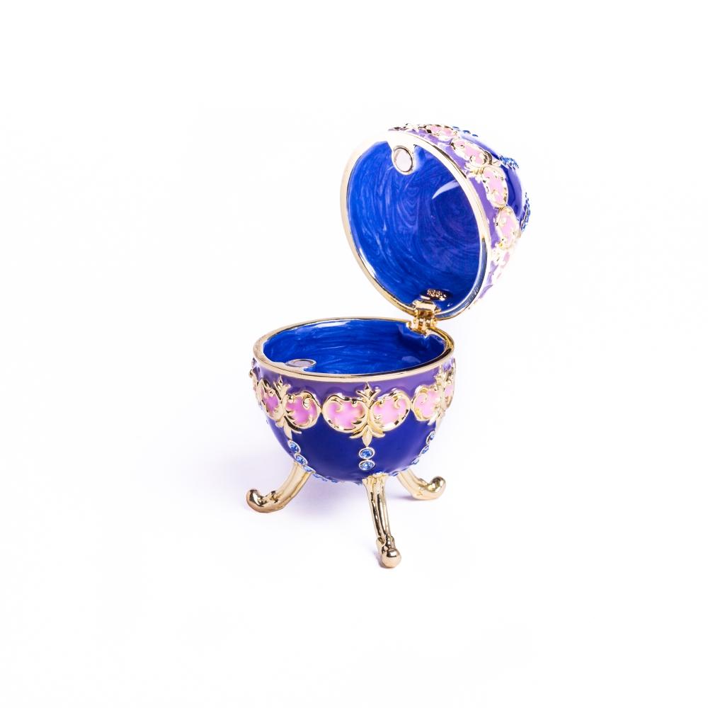 A beautifully crafted Blue Decorated Faberge Egg trinket box adorned with Austrian crystals and 24K gold plating, showcasing intricate details.