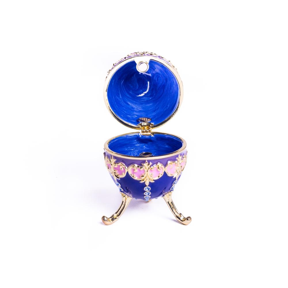 A beautifully crafted Blue Decorated Faberge Egg trinket box adorned with Austrian crystals and 24K gold plating, showcasing intricate details.