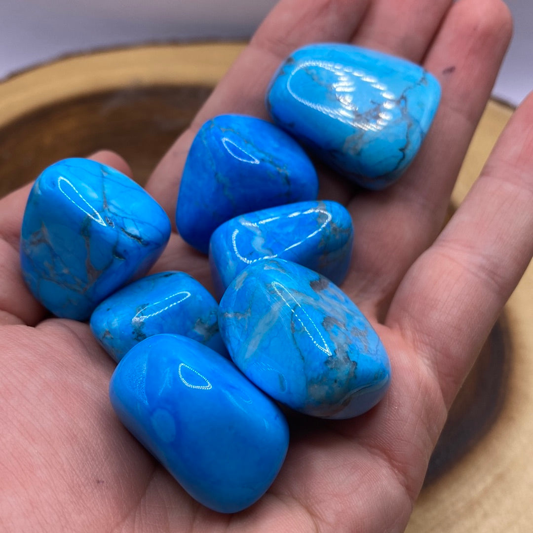 A vibrant piece of Blue Dyed Howlite showcasing its unique blue patterns and textures, symbolizing tranquility and positive energy.