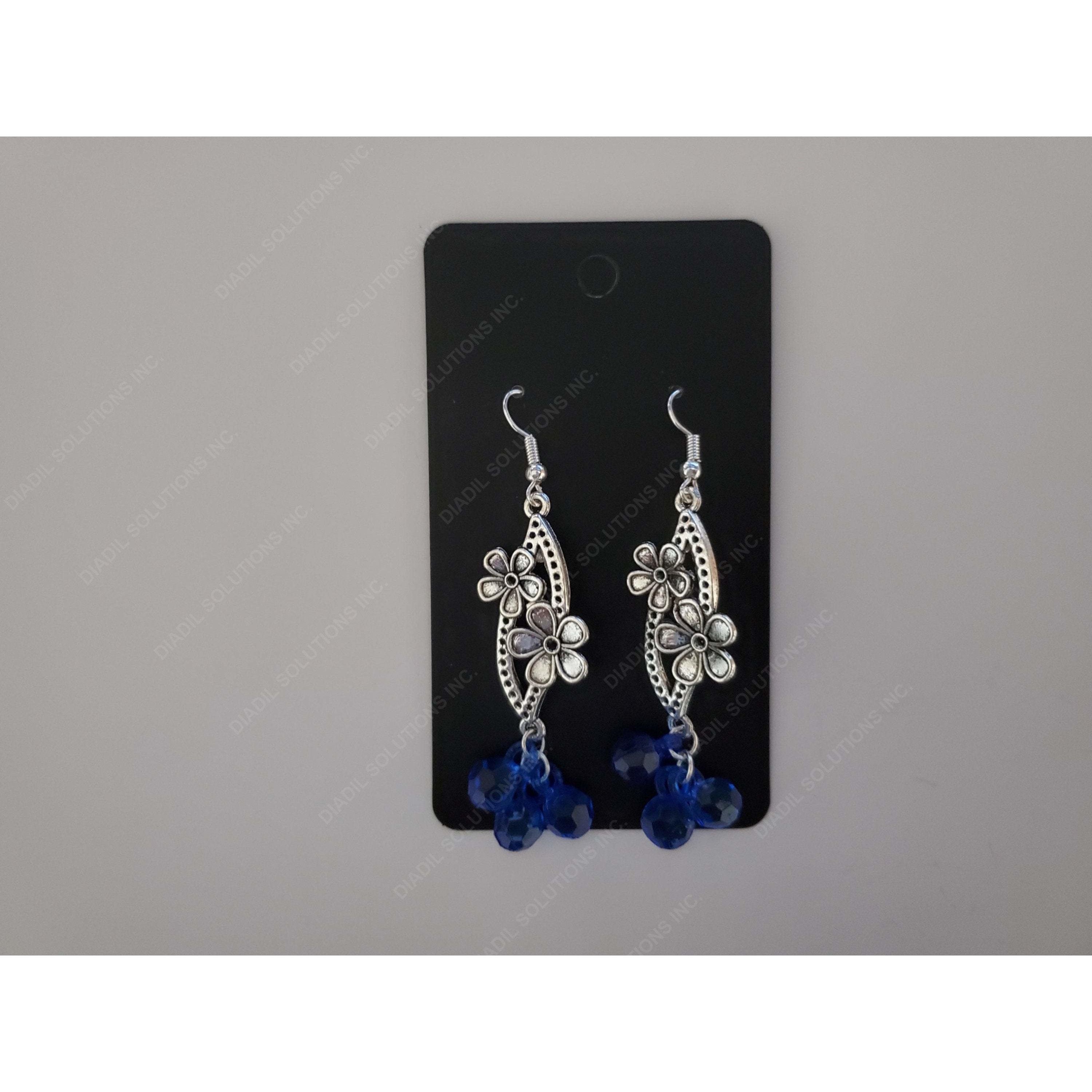 A pair of elegant blue earrings with a translucent finish, showcasing their unique design and shimmering quality.