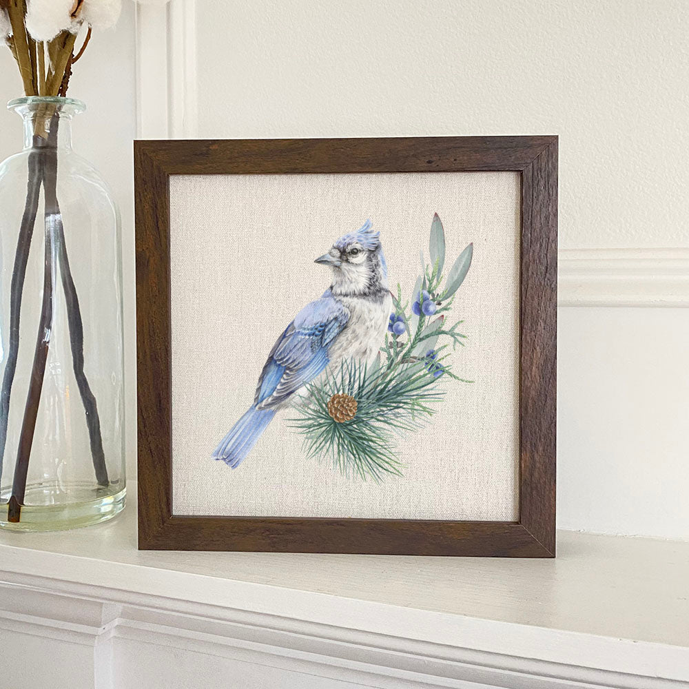 A beautifully framed Blue Jay sign with a stylized wood frame, featuring eco-friendly ink printing on a linen-look background.