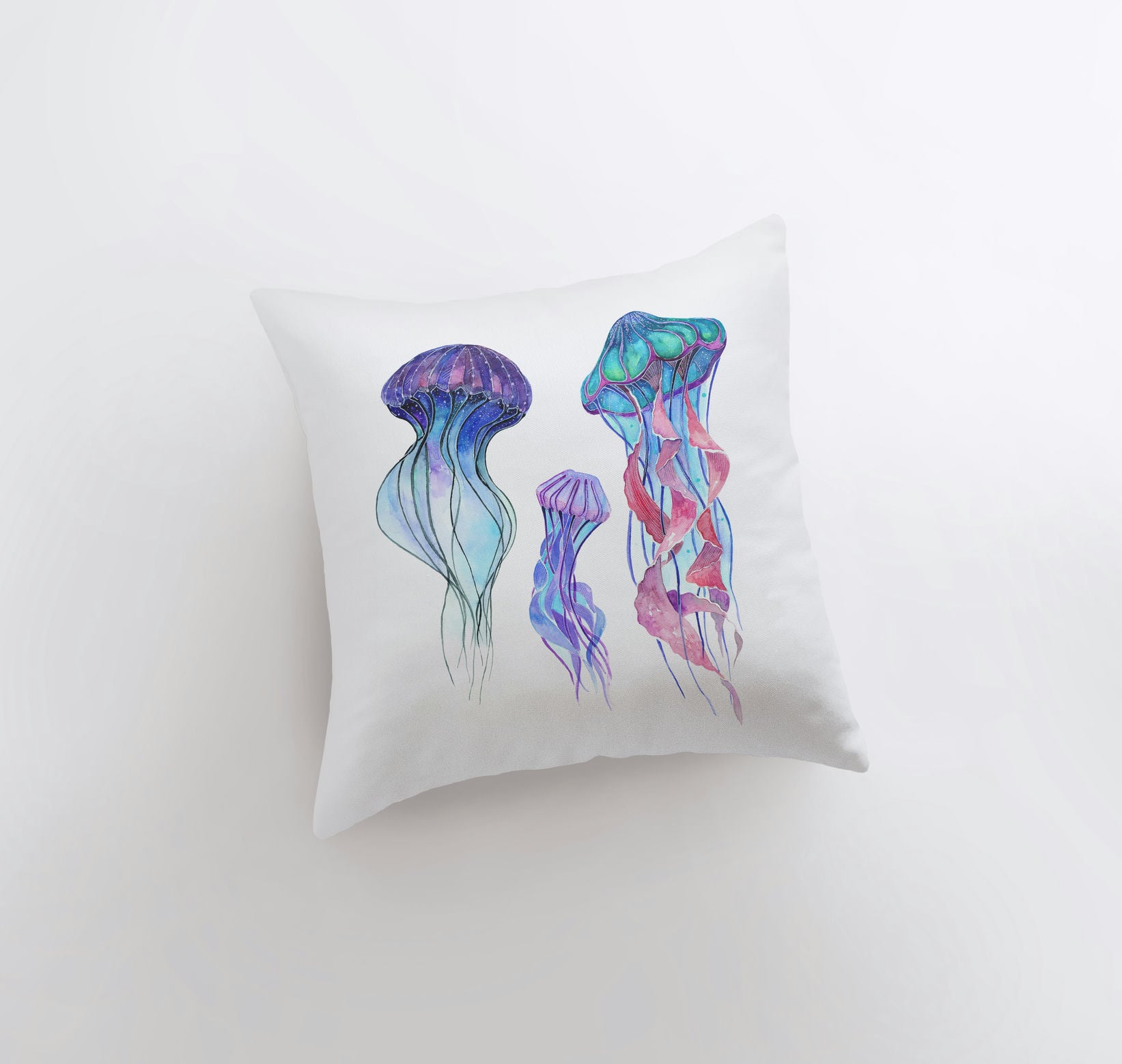 A beautifully designed Blue Jelly Fish pillow cover featuring a vibrant jellyfish on one side and a repeating pattern on the other, perfect for coastal decor.