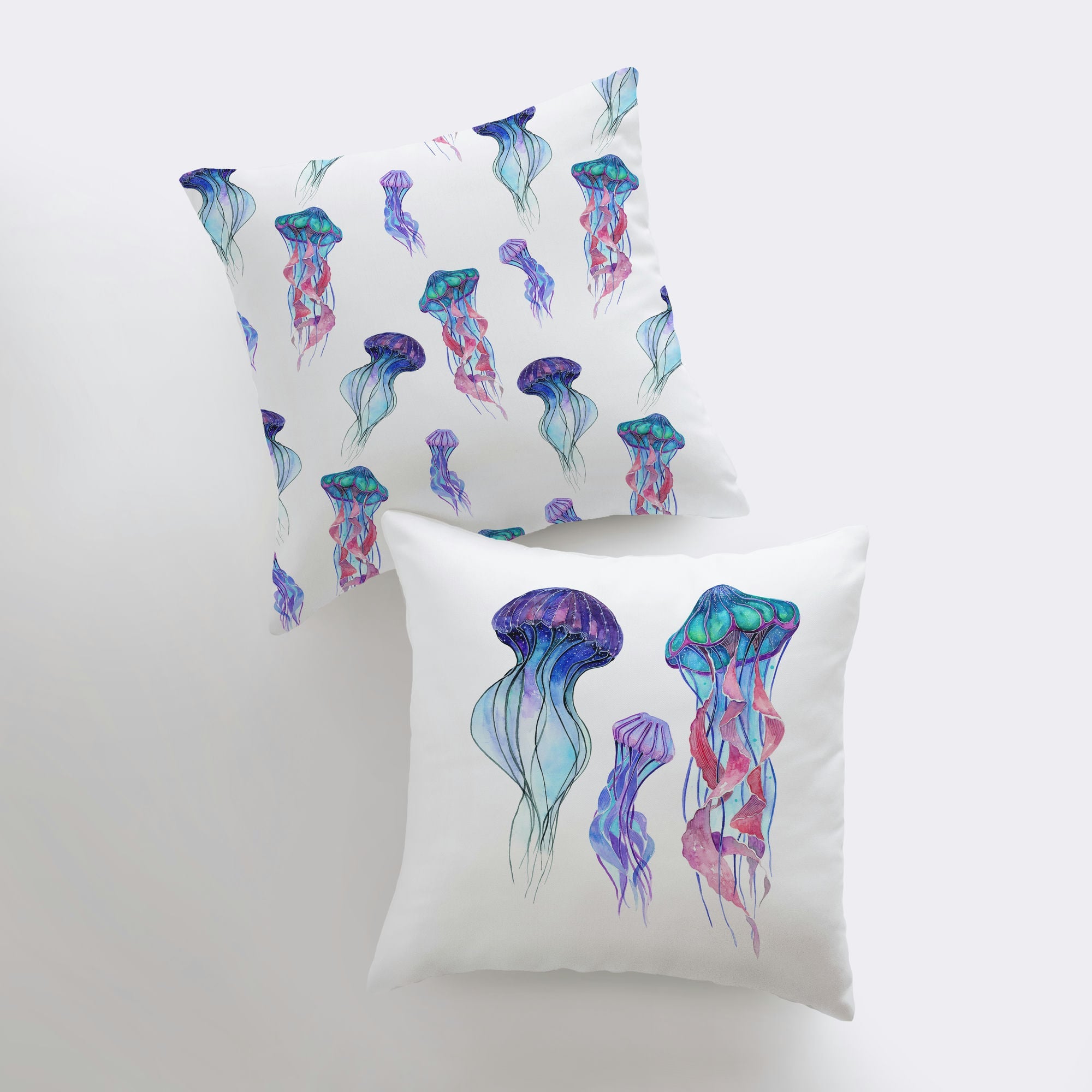 A beautifully designed Blue Jelly Fish pillow cover featuring a vibrant jellyfish on one side and a repeating pattern on the other, perfect for coastal decor.