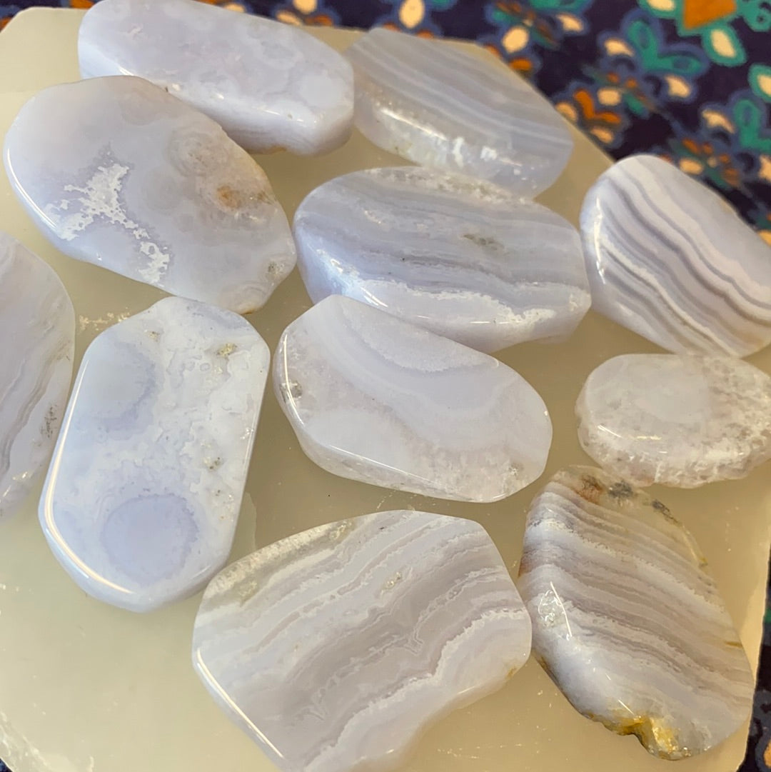 Polished Blue Lace Agate Slabs showcasing intricate blue and white lace patterns, perfect for spiritual growth and healing.