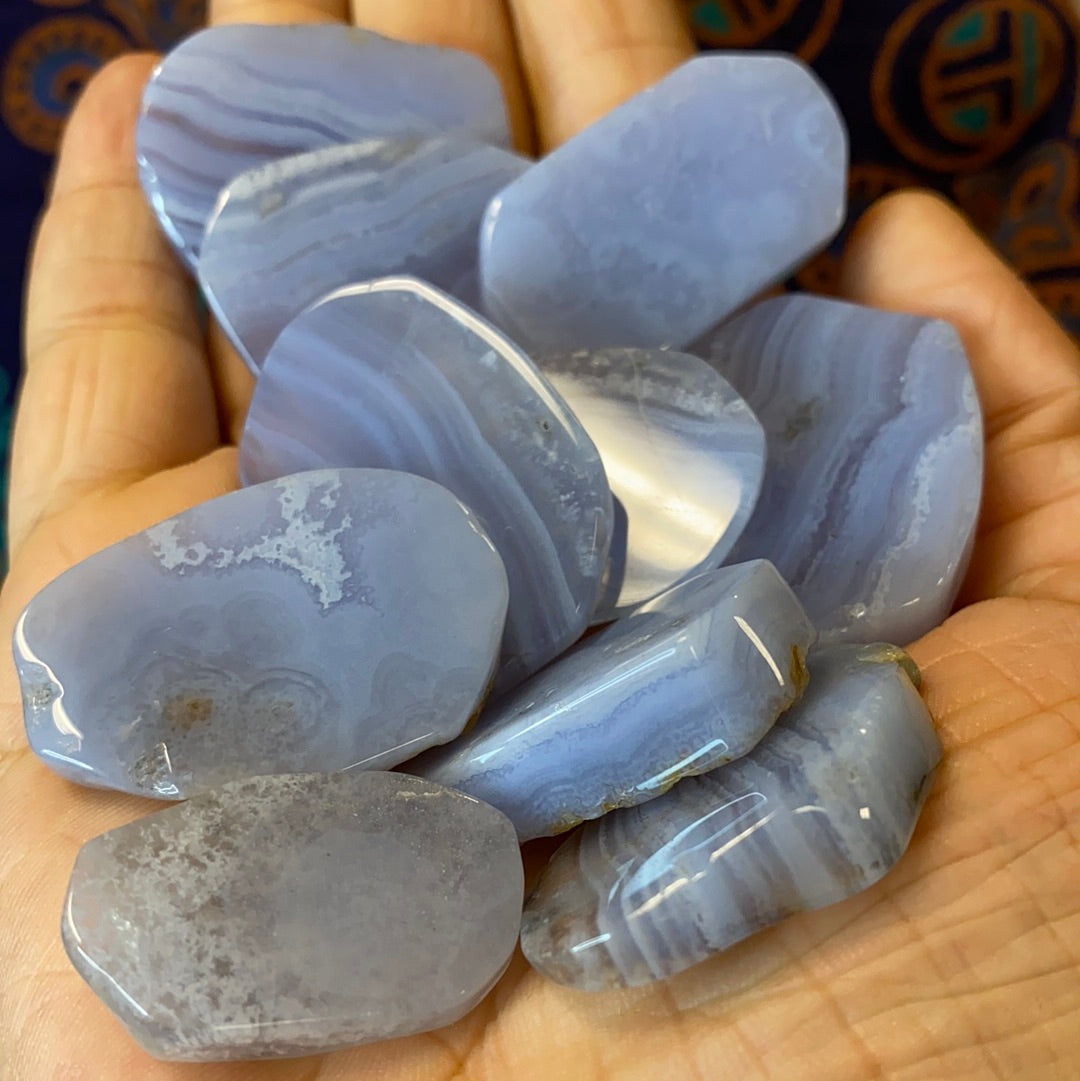 Polished Blue Lace Agate Slabs showcasing intricate blue and white lace patterns, perfect for spiritual growth and healing.