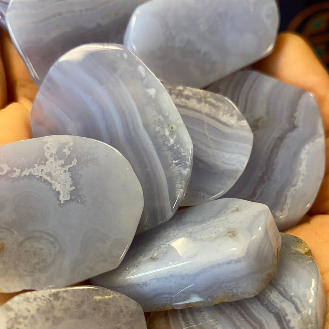 Polished Blue Lace Agate Slabs showcasing intricate blue and white lace patterns, perfect for spiritual growth and healing.