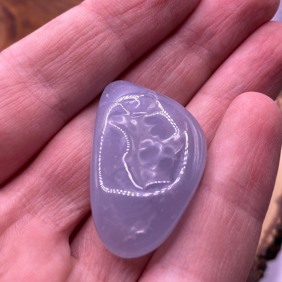 Blue Lace Agate Tumbled Stone showcasing a beautiful blue and white lace pattern, perfect for healing and spiritual growth.