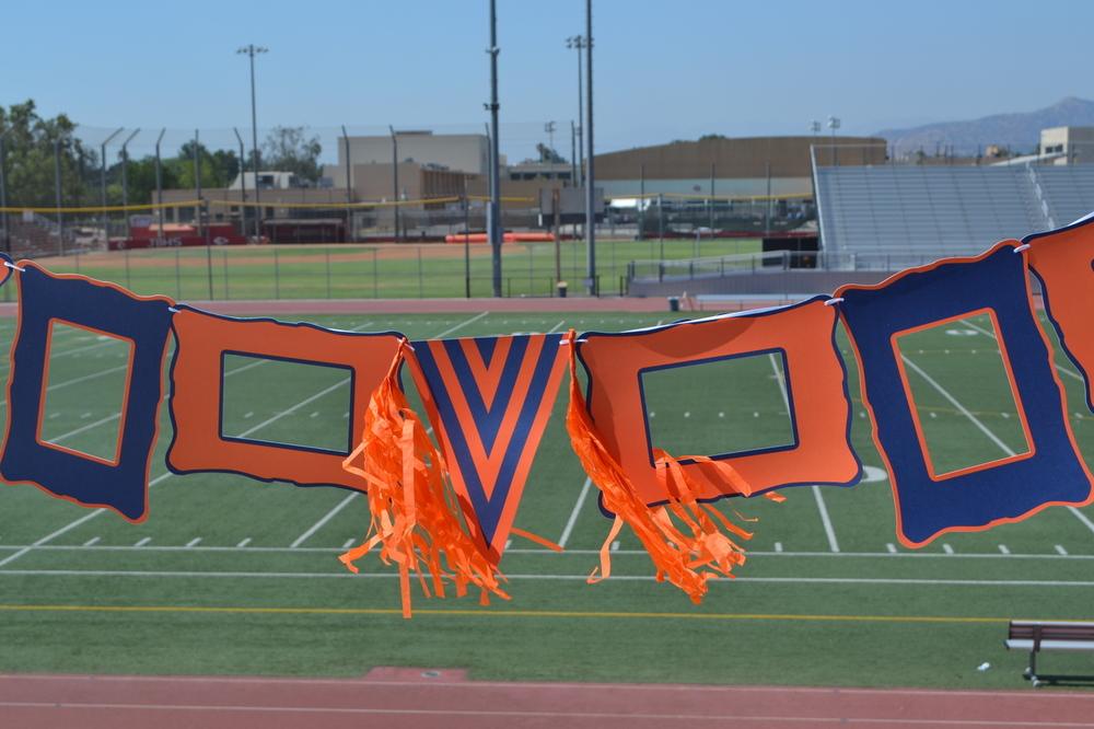 Colorful Blue & Orange decor set featuring paper frames, pennant, ribbon, and tassels for festive occasions.