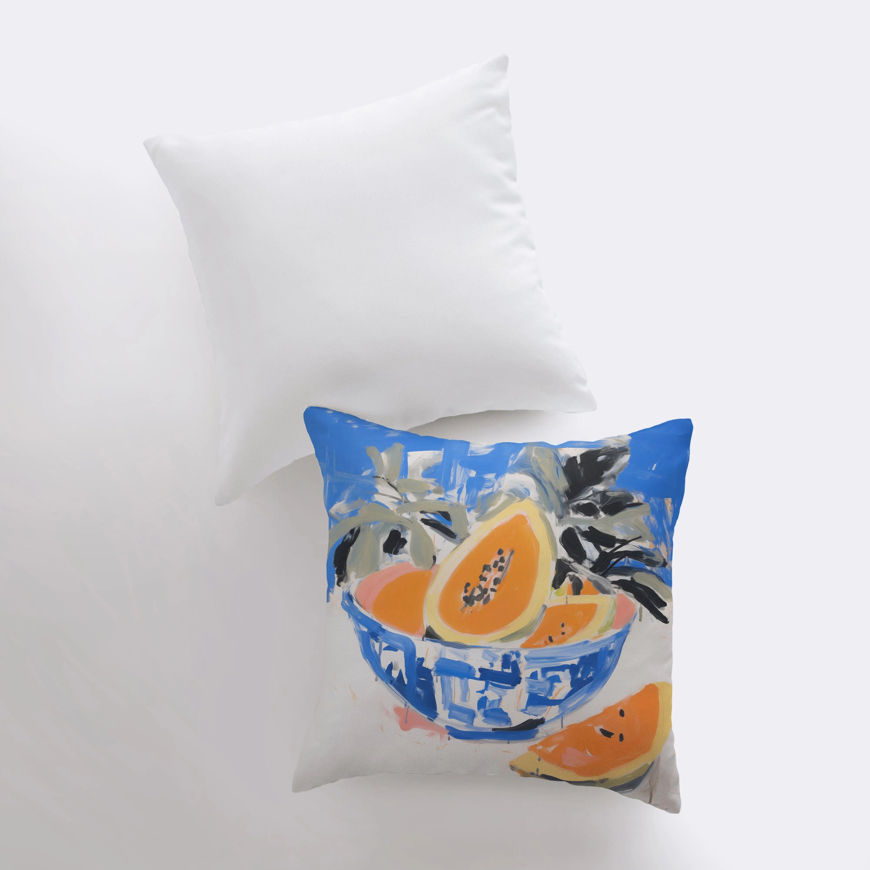 A vibrant blue papaya bowl pillow featuring a gouache painting, showcasing a colorful fruit design on a cotton/polyester blend fabric.