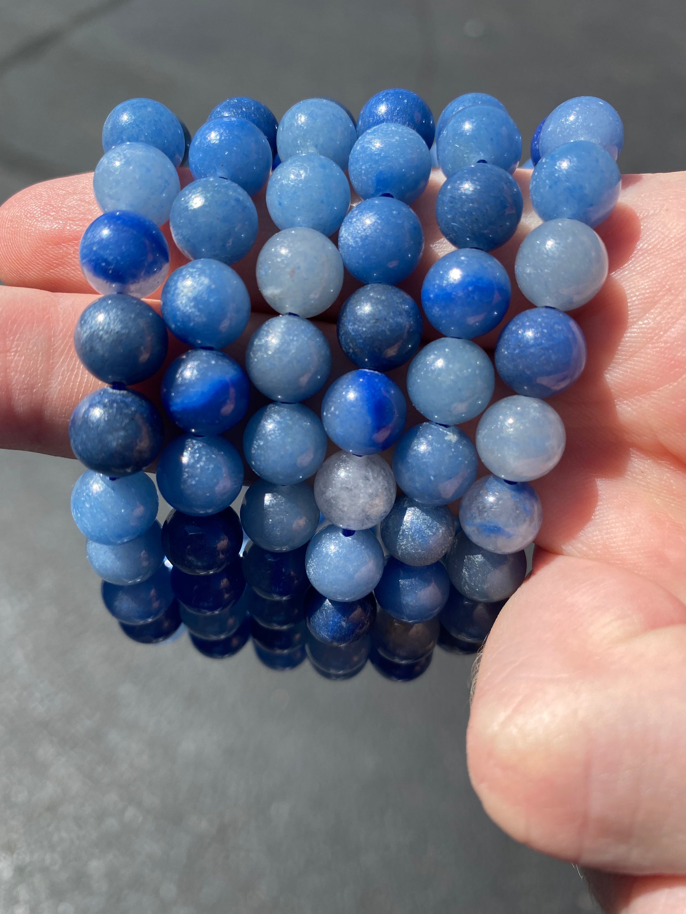 A beautiful 8mm Blue Quartz bracelet showcasing its bright blue color and smooth finish, perfect for healing and tranquility.