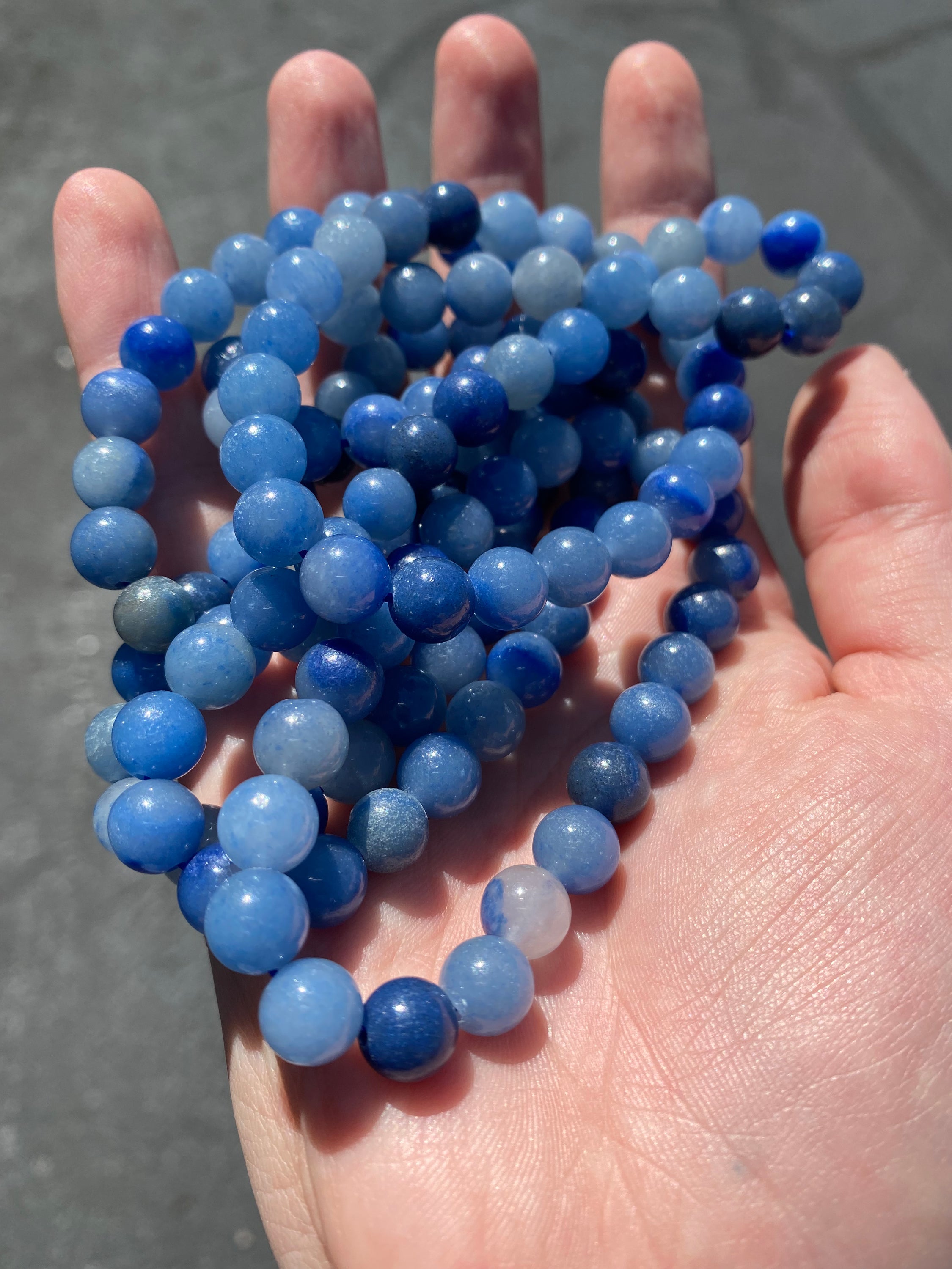 A beautiful 8mm Blue Quartz bracelet showcasing its bright blue color and smooth finish, perfect for healing and tranquility.