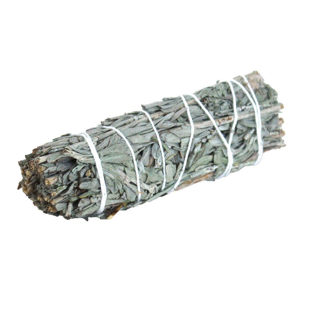 A 4-inch Blue Sage Stick, hand-tied with natural twine, emitting aromatic smoke for cleansing and meditation.