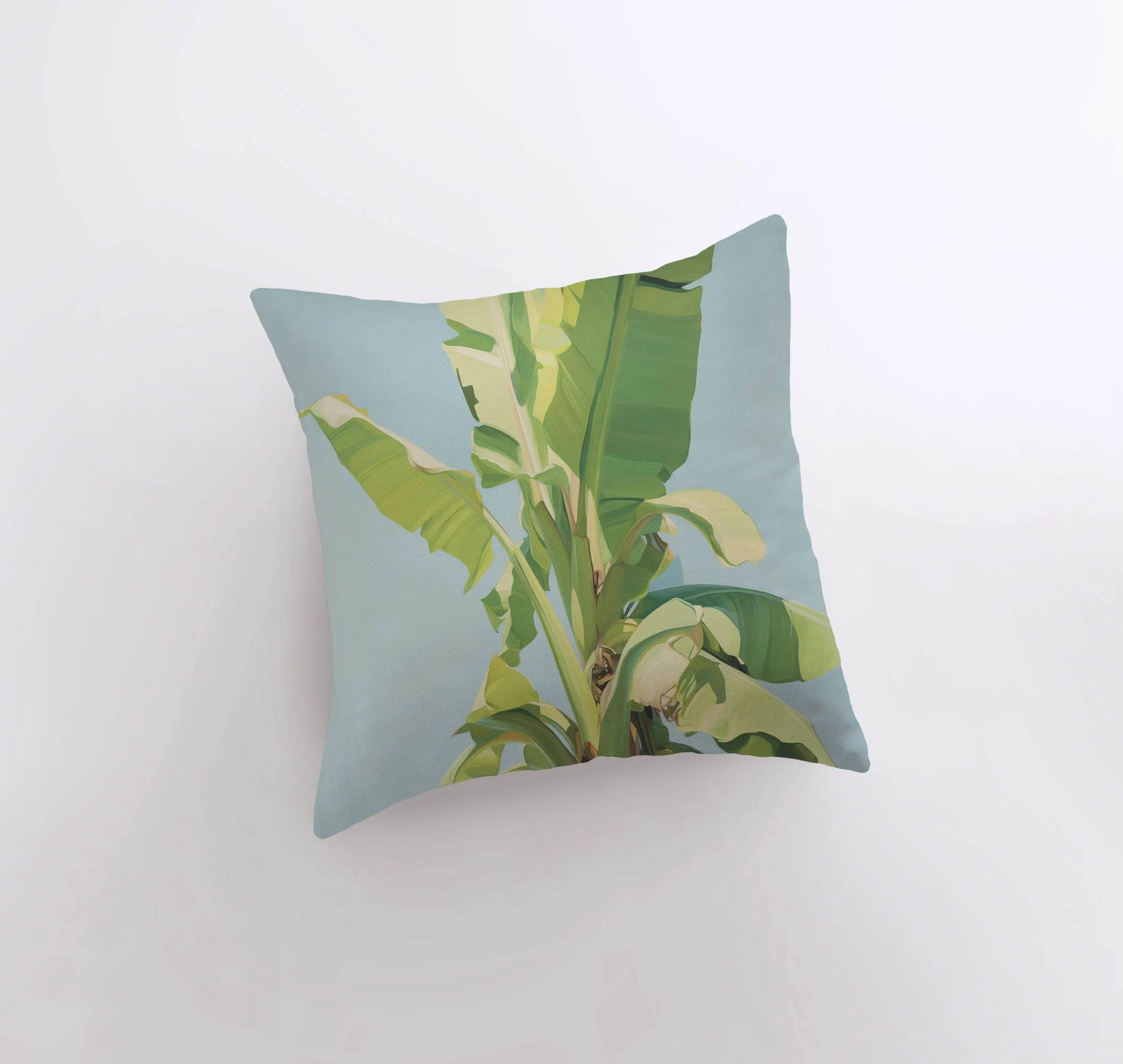 Blue Sky Palm Tree throw pillow featuring a vibrant palm tree design on a blue background, with a white back and concealed zipper.