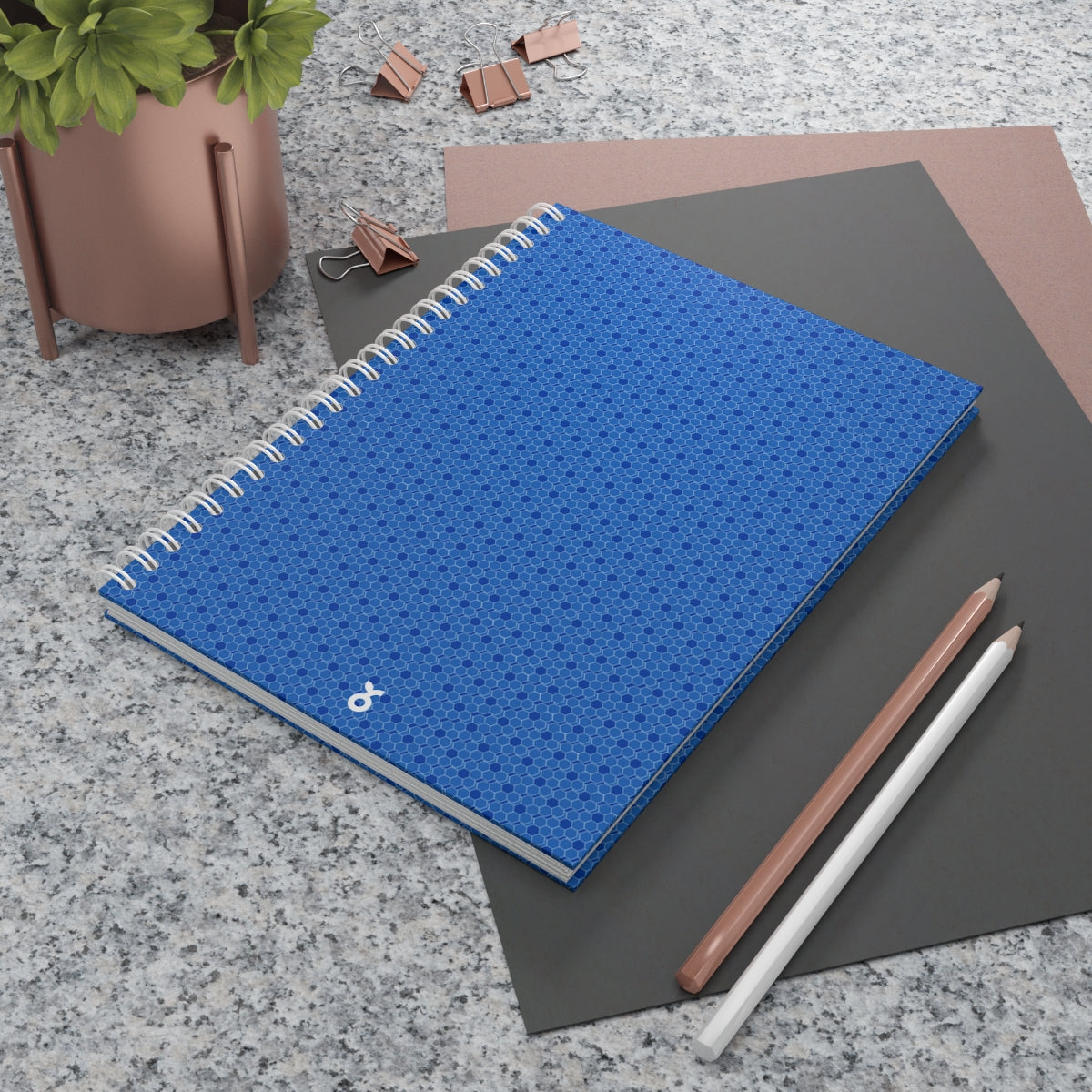 A stylish blue spiral notebook with customizable covers and wide-ruled pages, perfect for journaling and note-taking.