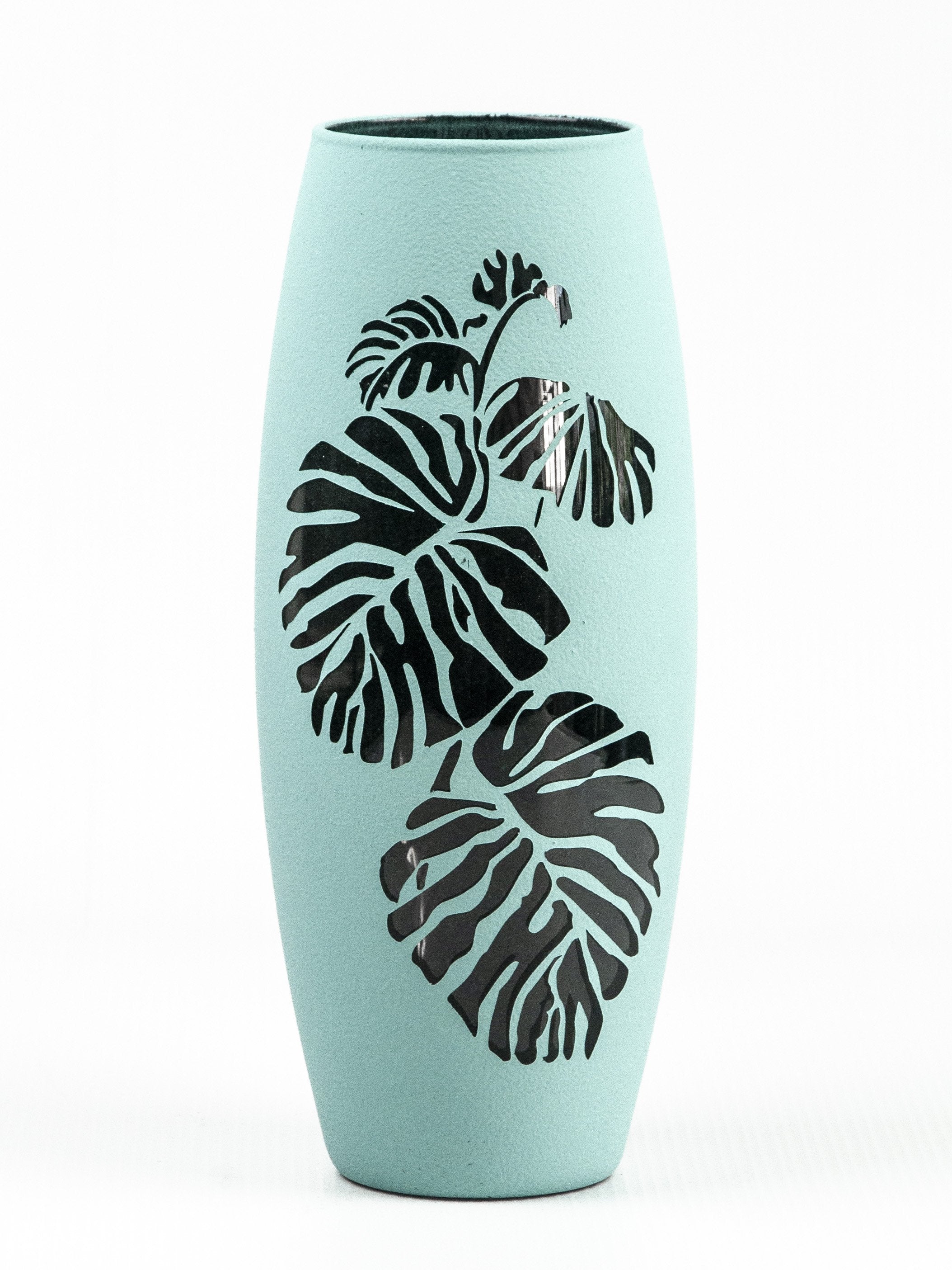 A beautifully hand-painted blue tropical art glass oval vase, showcasing intricate designs and vibrant colors, perfect for floral arrangements.