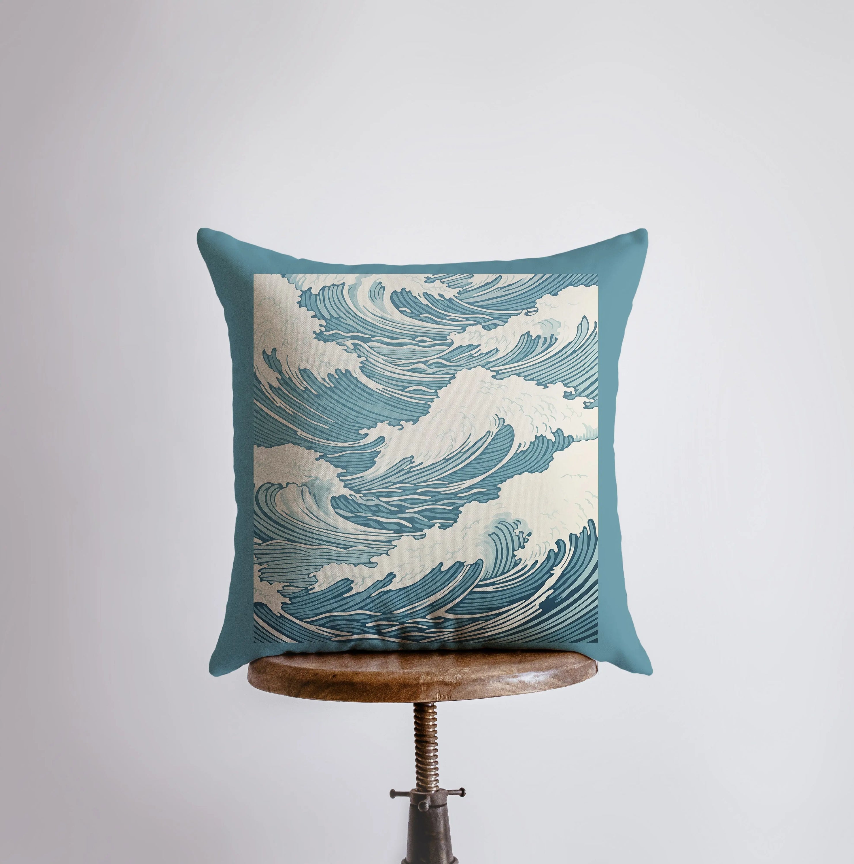 Blue Waves throw pillow featuring ocean wave design on front and white back, handmade in America.