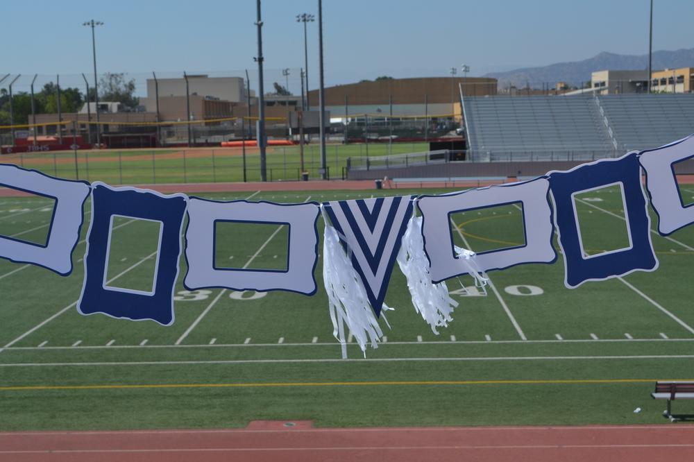 Blue and white party decoration set featuring paper frames, pennant, ribbon, and tassels.