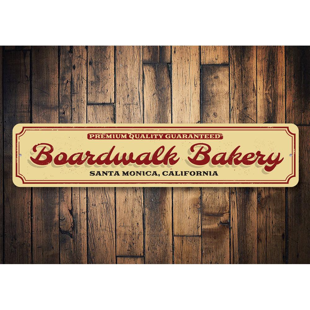 A decorative Boardwalk Bakery Sign made of high-quality aluminum, featuring customizable text for beach-themed decor.