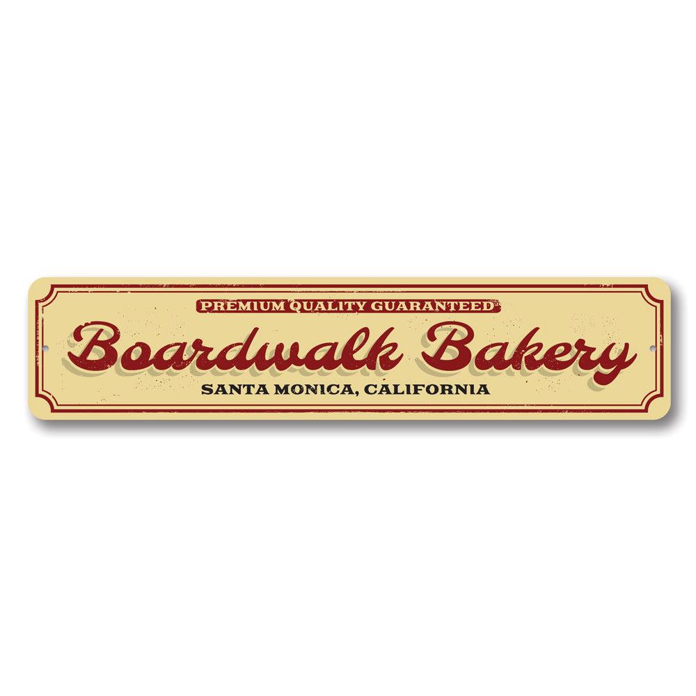 A decorative Boardwalk Bakery Sign made of high-quality aluminum, featuring customizable text for beach-themed decor.