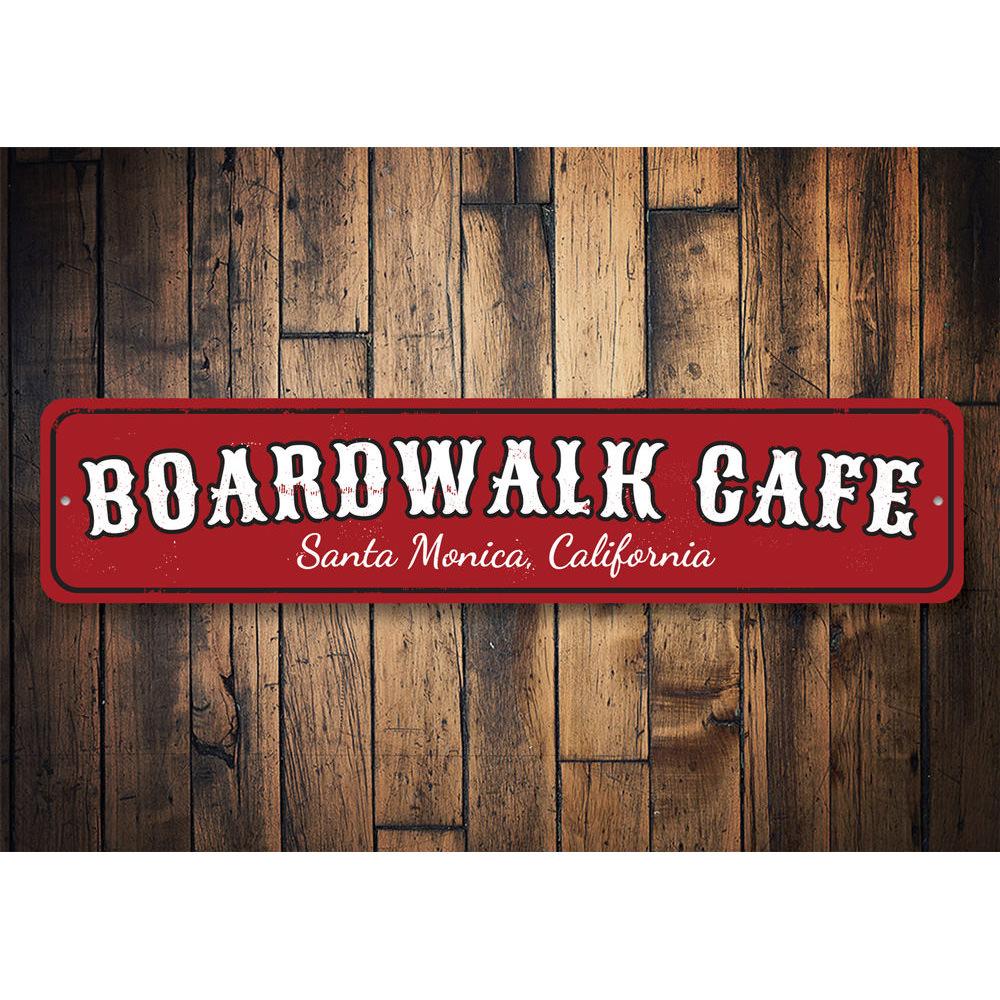 A decorative Boardwalk Cafe Sign made of high-quality aluminum, featuring customizable text for beach-themed decor.