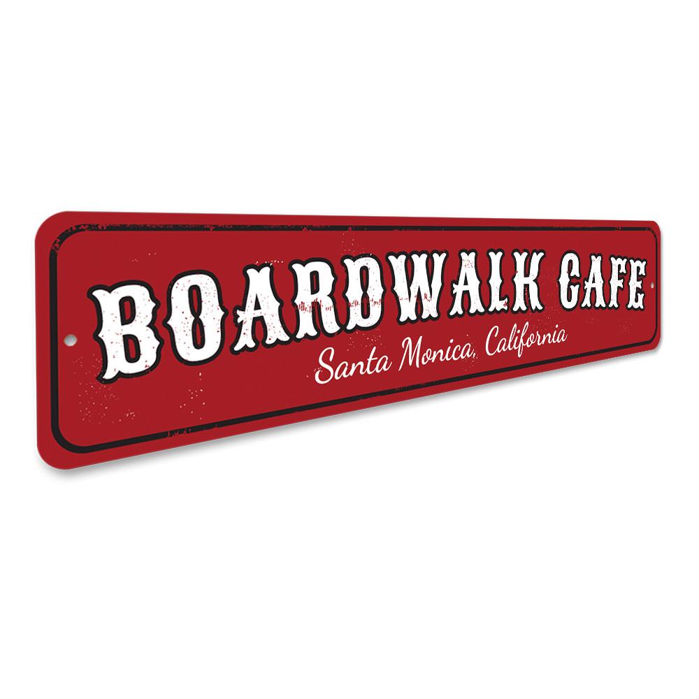 A decorative Boardwalk Cafe Sign made of high-quality aluminum, featuring customizable text for beach-themed decor.