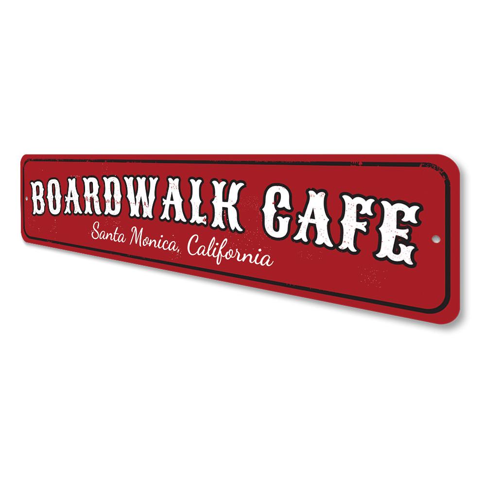 A decorative Boardwalk Cafe Sign made of high-quality aluminum, featuring customizable text for beach-themed decor.