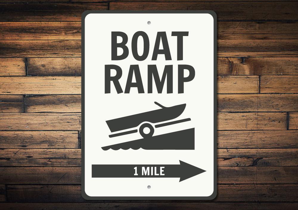 Boat Ramp Directional Sign made of durable aluminum, featuring customizable text and pre-drilled holes for easy mounting, perfect for lakehouse decor.