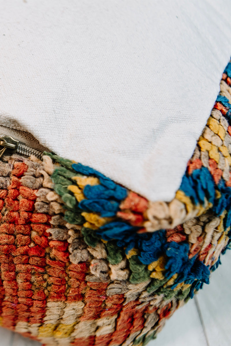 Bonbon Bebe Berber Pillow, a colorful 28x28 wool cushion featuring vibrant patterns from the Boujad Berber tribe.