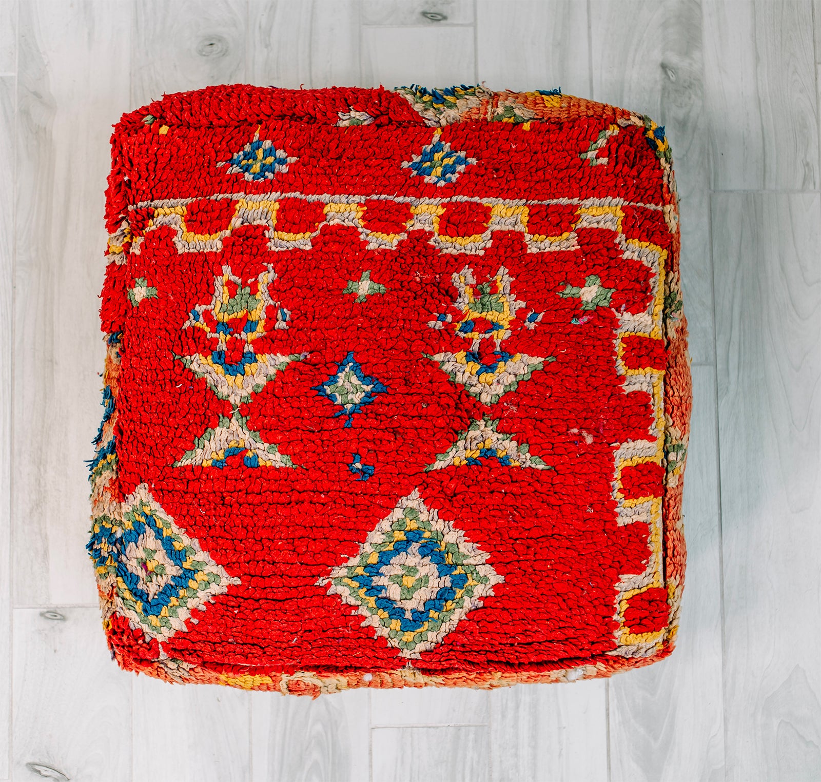 Bonbon Bebe Berber Pillow, a colorful 28x28 wool cushion featuring vibrant patterns from the Boujad Berber tribe.