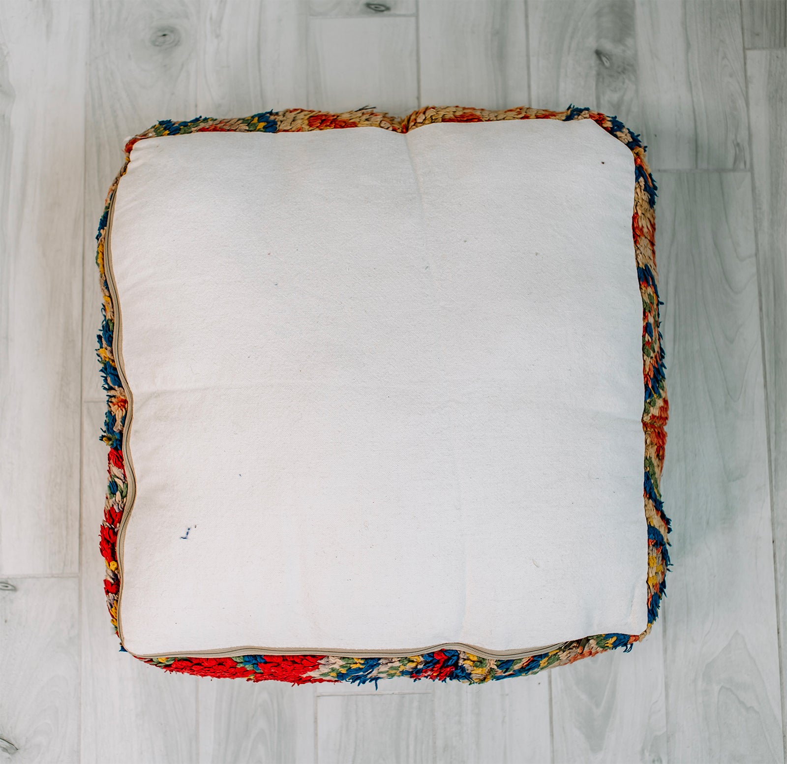 Bonbon Bebe Berber Pillow, a colorful 28x28 wool cushion featuring vibrant patterns from the Boujad Berber tribe.