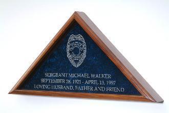 Border Patrol Flag Display Case made from solid oak with personalized engraving and blue crushed velvet background.