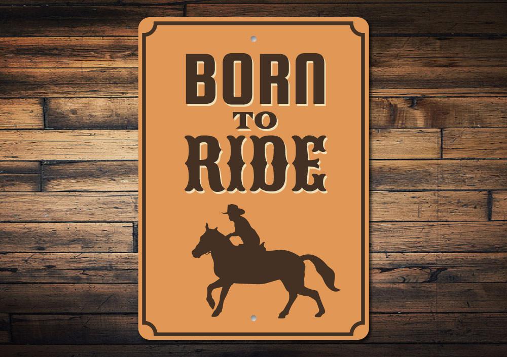 A decorative 'Born to Ride' sign made of high-quality aluminum, featuring a bold design suitable for man caves or garages.