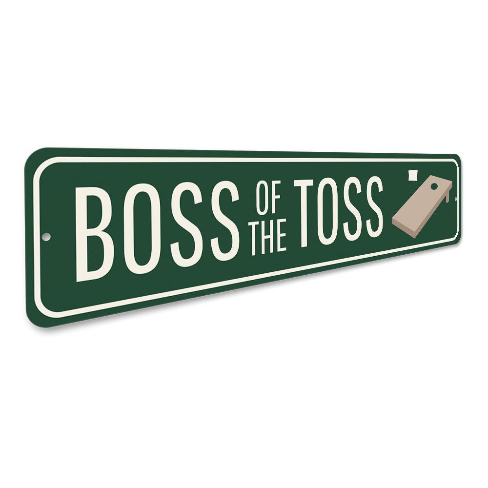 A decorative Boss of the Toss Sign made from high-quality aluminum, featuring customizable text and pre-drilled holes for easy mounting.