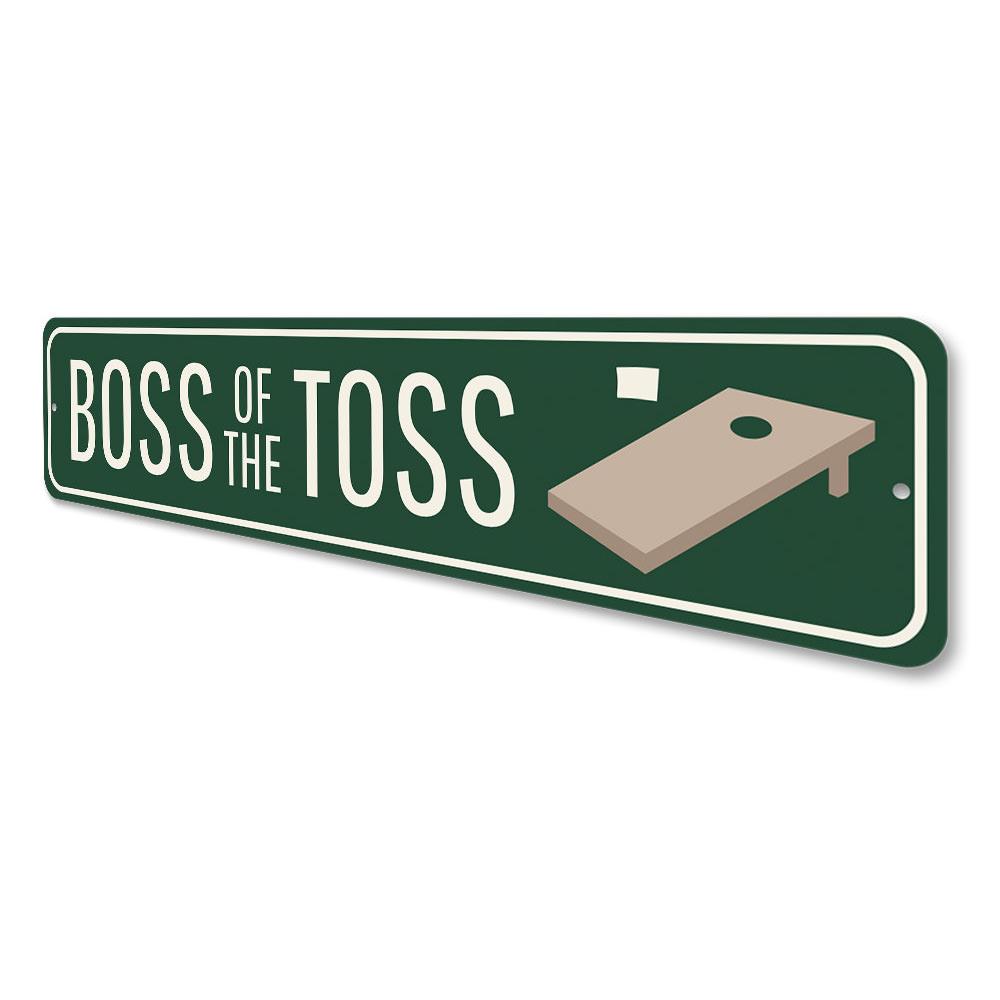 A decorative Boss of the Toss Sign made from high-quality aluminum, featuring customizable text and pre-drilled holes for easy mounting.