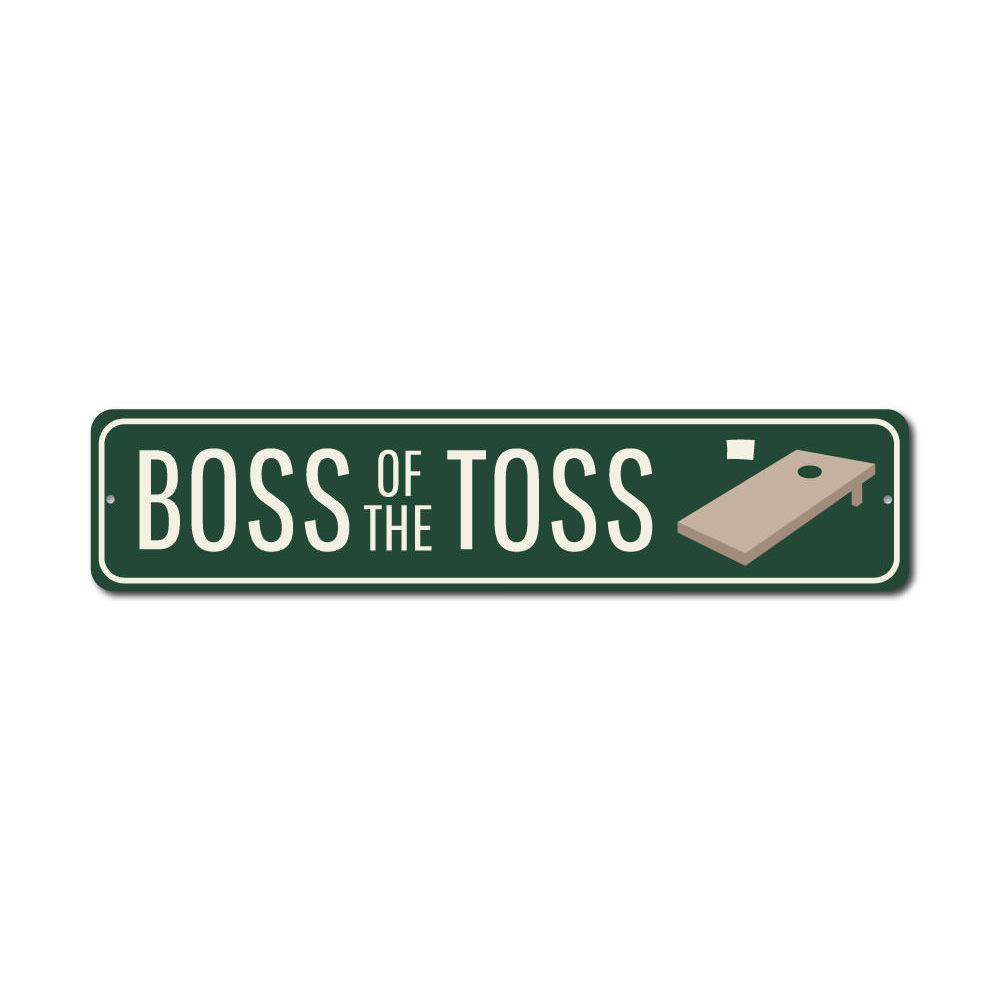 A decorative Boss of the Toss Sign made from high-quality aluminum, featuring customizable text and pre-drilled holes for easy mounting.