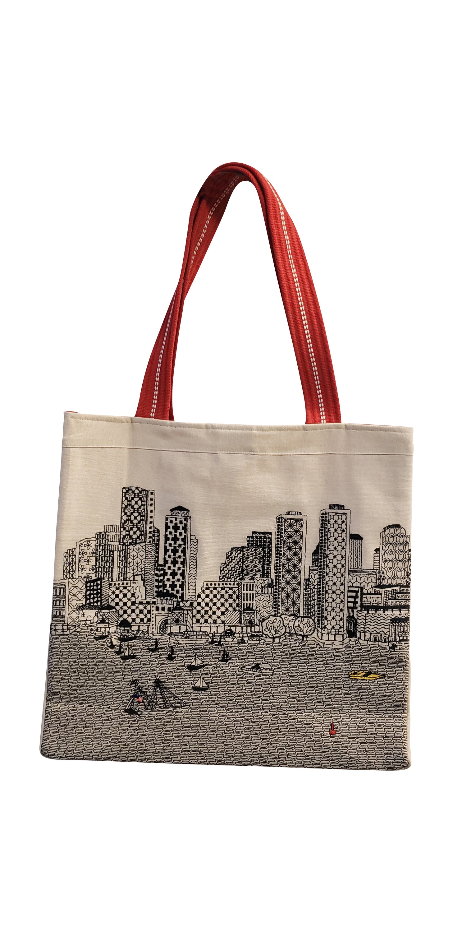 Boston Tote Bag featuring an embroidered skyline design, available in cream and black with red waterproof lining and ribbed straps.