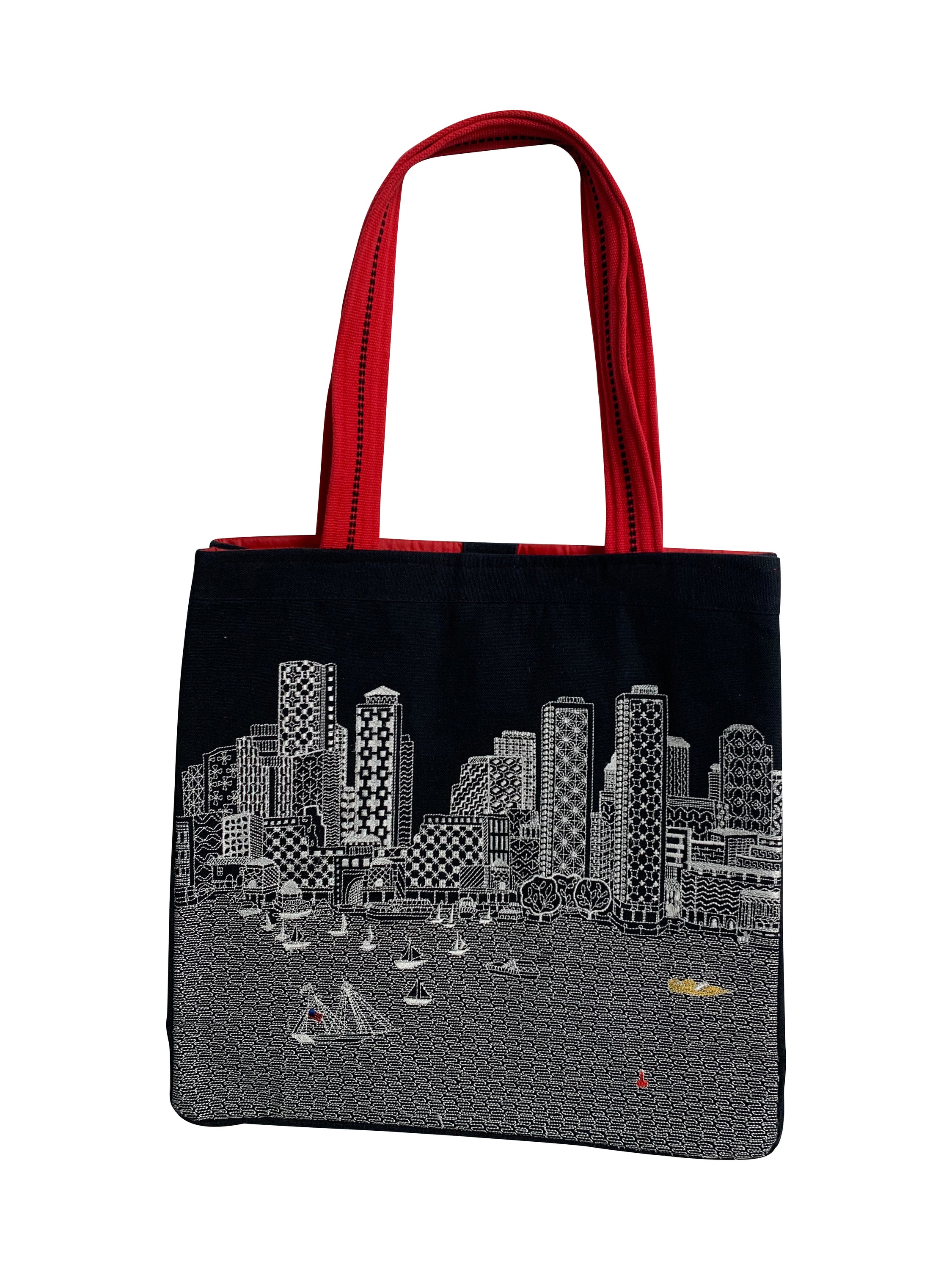 Boston Tote Bag featuring an embroidered skyline design, available in cream and black with red waterproof lining and ribbed straps.