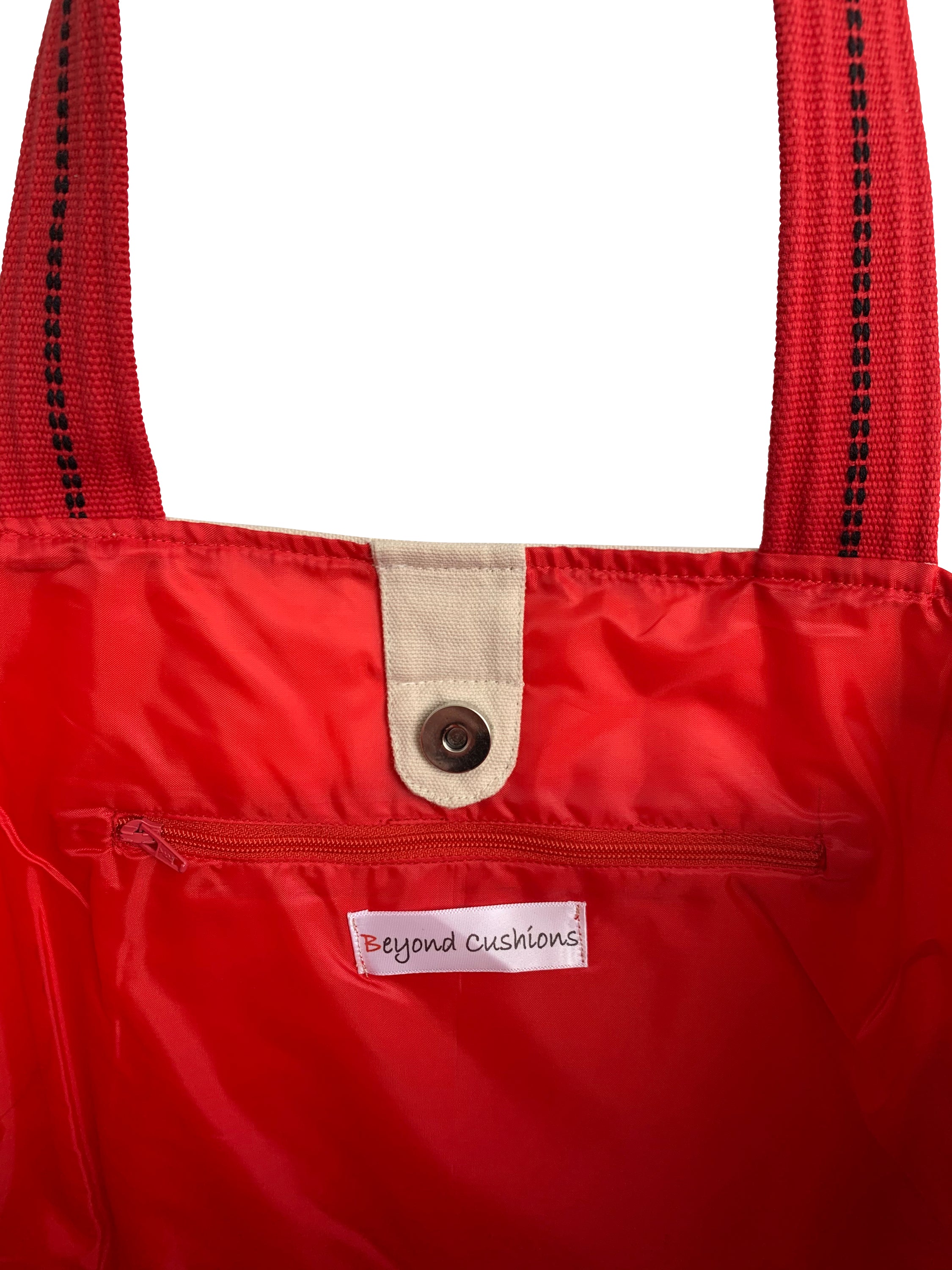 Boston Tote Bag featuring an embroidered skyline design, available in cream and black with red waterproof lining and ribbed straps.